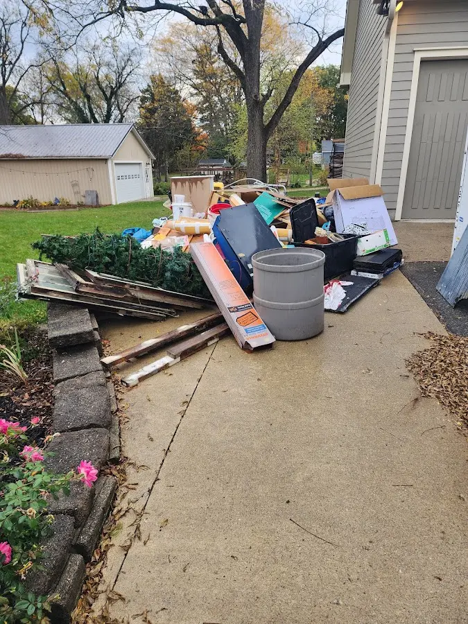 Dumpster being loaded with debris for 3 Yard Dumpster Rental in Maryville